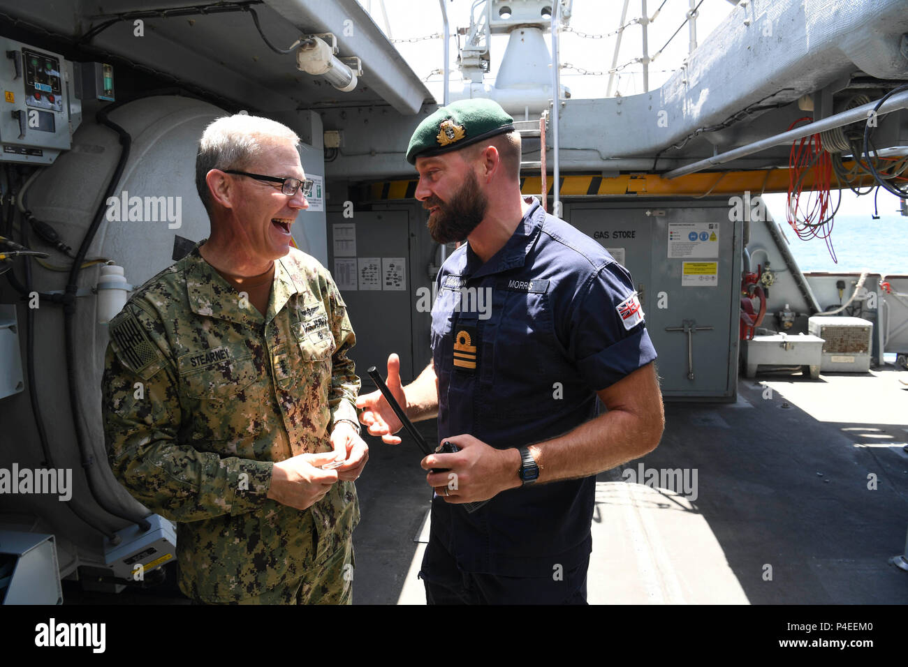 180617-N-TB177-0101 ARABIAN GULF (June 17, 2018) Vice Adm. Scott Stearney, commander of U.S. Naval Forces Central Command, U.S. 5th Fleet, Combined Maritime Forces, left, speaks with Lt. Commander Daniel Morris, aboard HMS Middleton during Mine Countermeasures Exercise (MCMEX) 18-2. The bilateral exercise enhances cooperation, mutual MCM capabilities and interoperability between the U.S. and U.K., demonstrating the shared commitment of ensuring unfettered operations of naval and support vessels, as well as commercial shipping movements, throughout the maritime domain. (U.S. Navy photo by Mass  Stock Photo