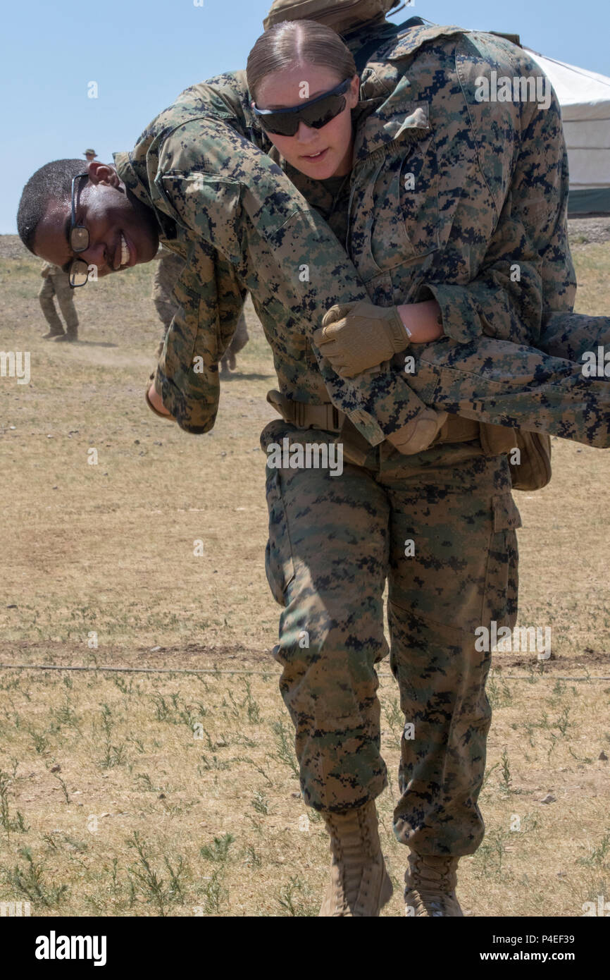 U.S. Marine Corps Lance Cpl. Jasmine Huffman performs a Fireman’s Carry