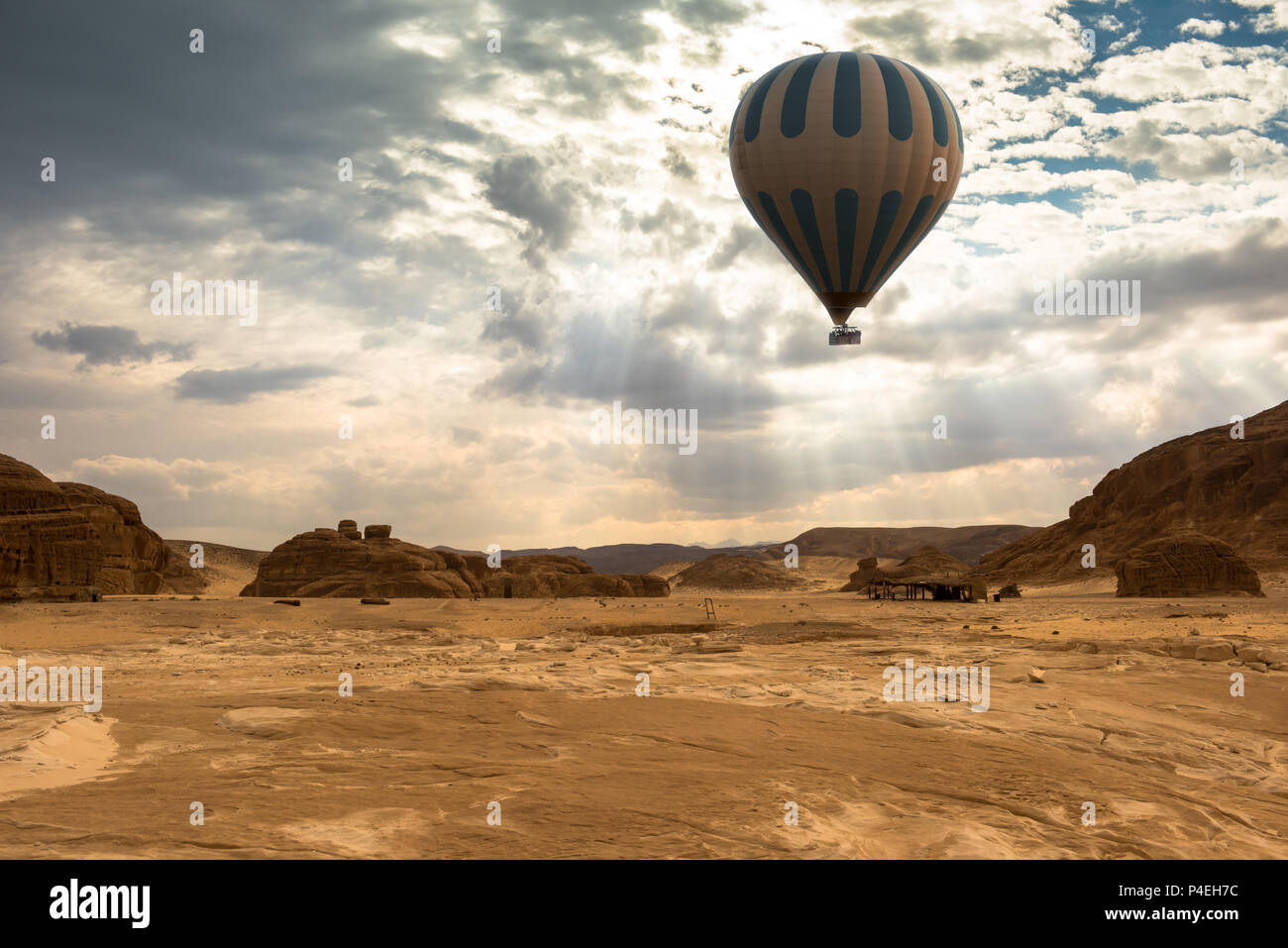Hot Air Balloon travel over desert Stock Photo