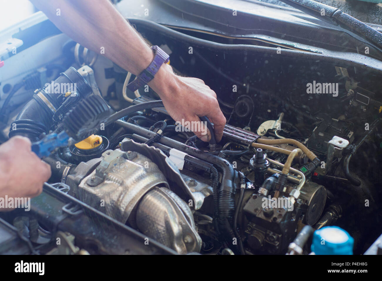 Auto mechanic repairing car. Selective focus. Stock Photo