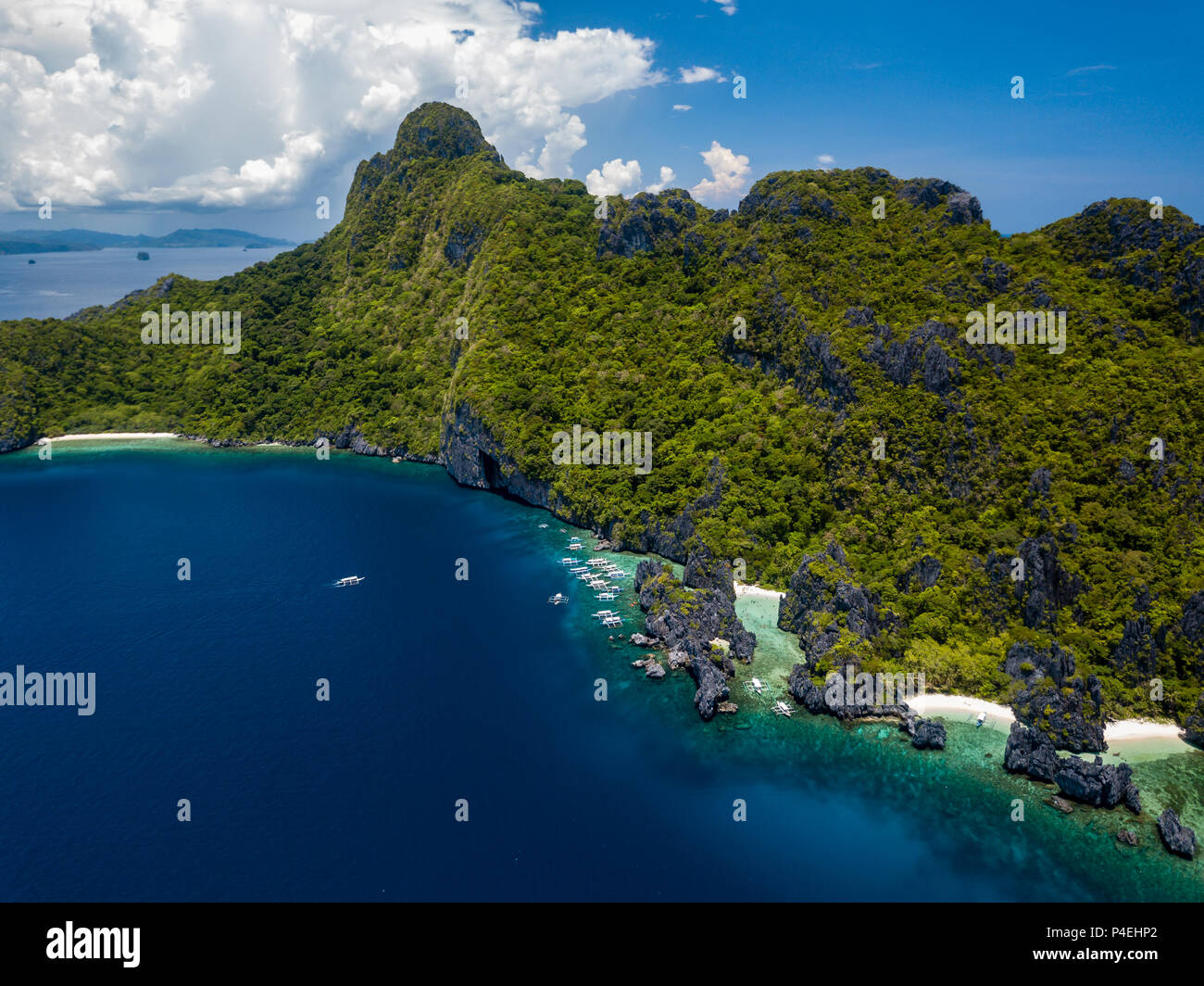 Aerial view of a beautiful tropical island with cliffs and mountains in the Bacuit Archipelago, Philippines Stock Photo