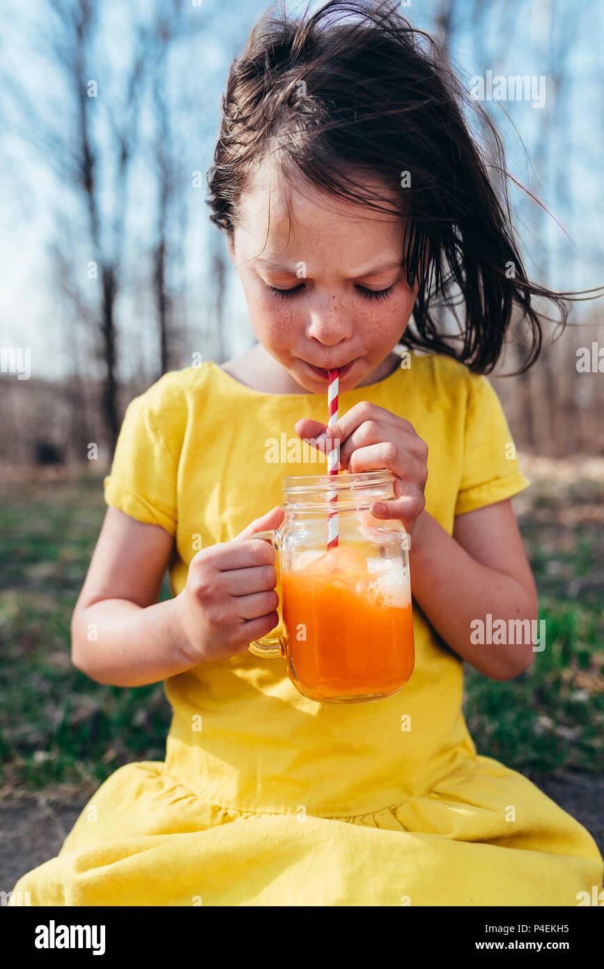 Girl enjoying a summer drink Stock Photo Alamy