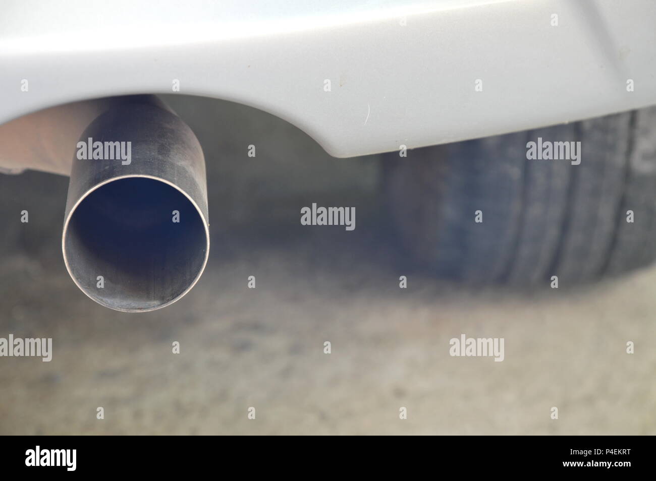 exhaust pipe under car bumper Stock Photo Alamy