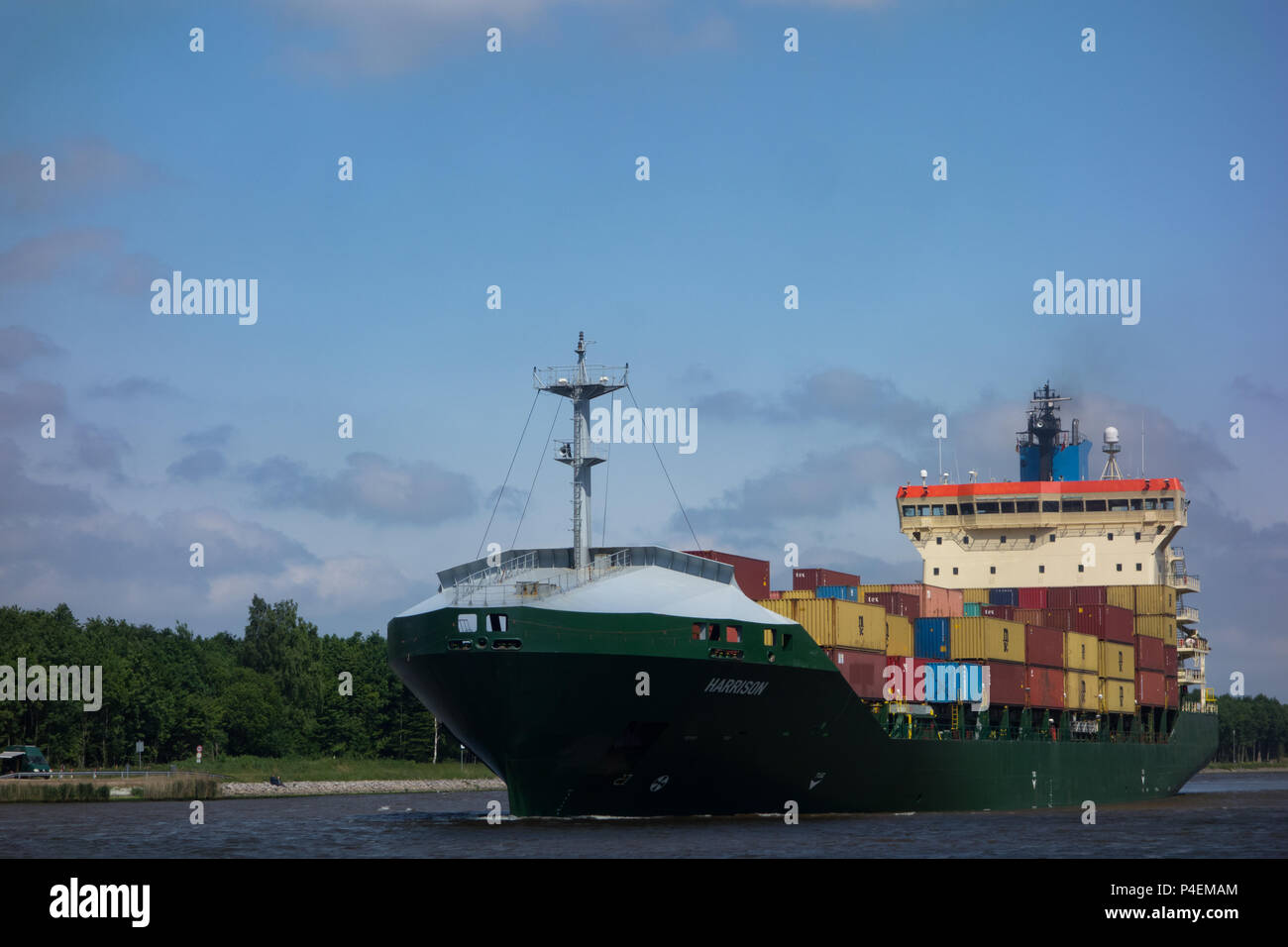 A large container ship in transit through the Kiel Canal, Germany Stock Photo