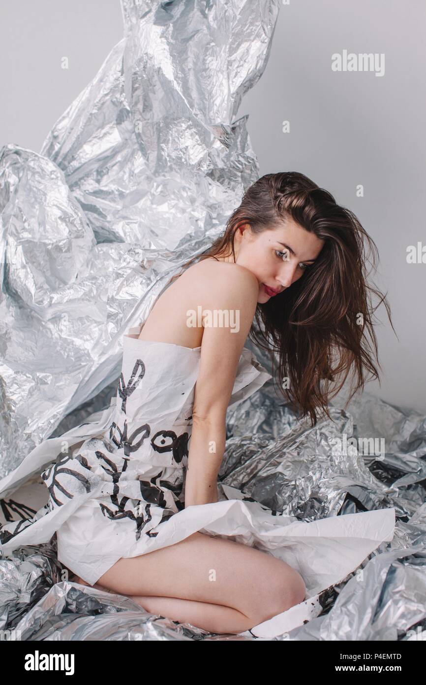 Woman wearing silver dress hi-res stock photography and images - Alamy