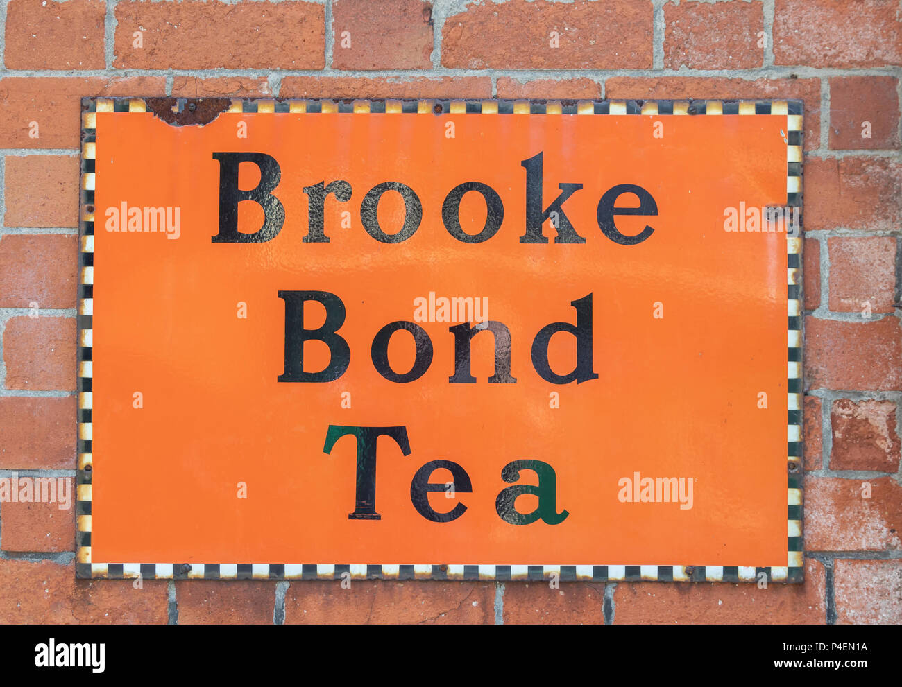 Old enamel Brooke Bond Tea sign on a wall in Leicestershire, United Kingdom Stock Photo