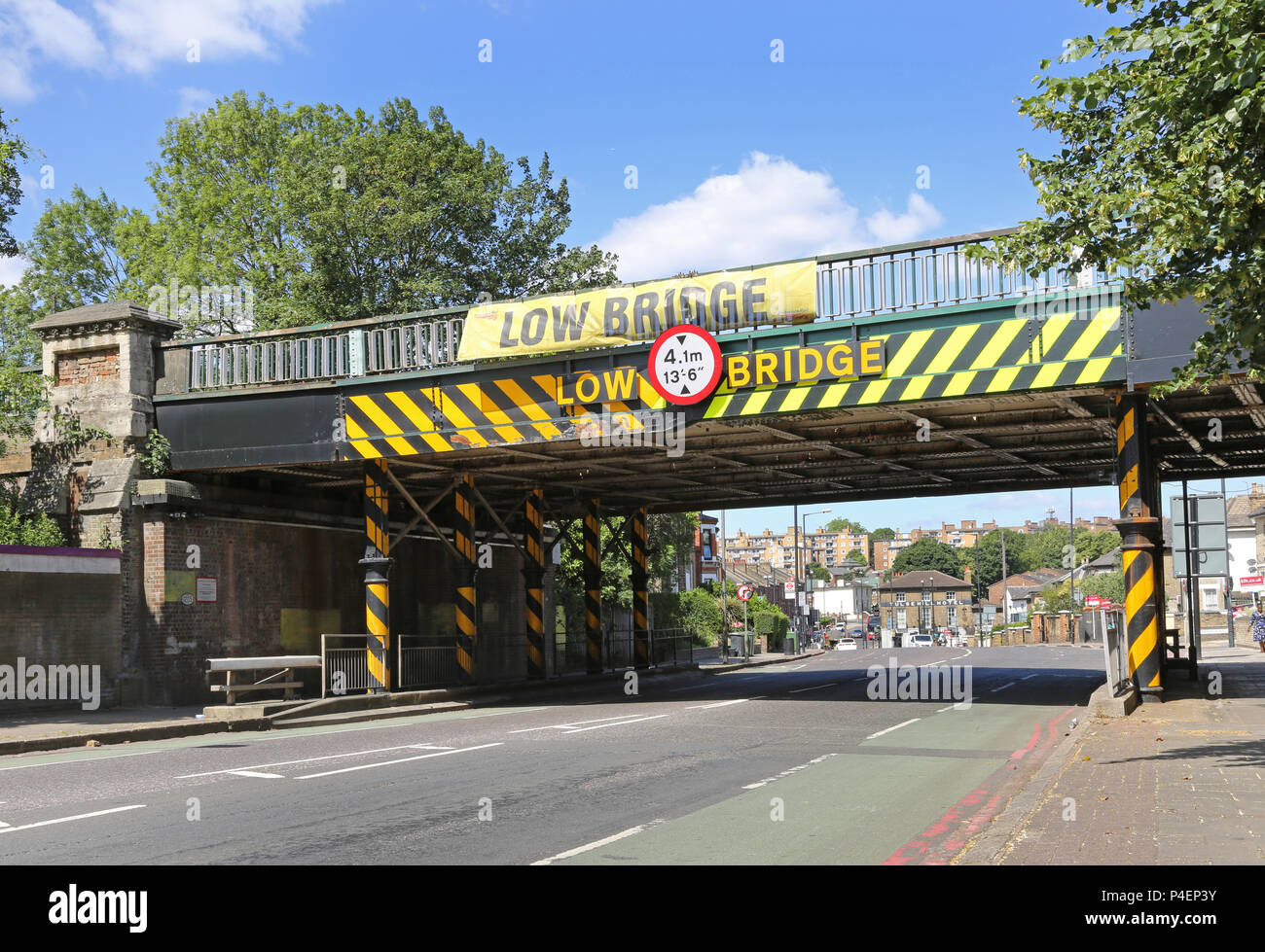 Low railway bridge on London's South Circular Road at Tulse Hill, UK. A notorious hazard for high vehicles - including busses. Stock Photo
