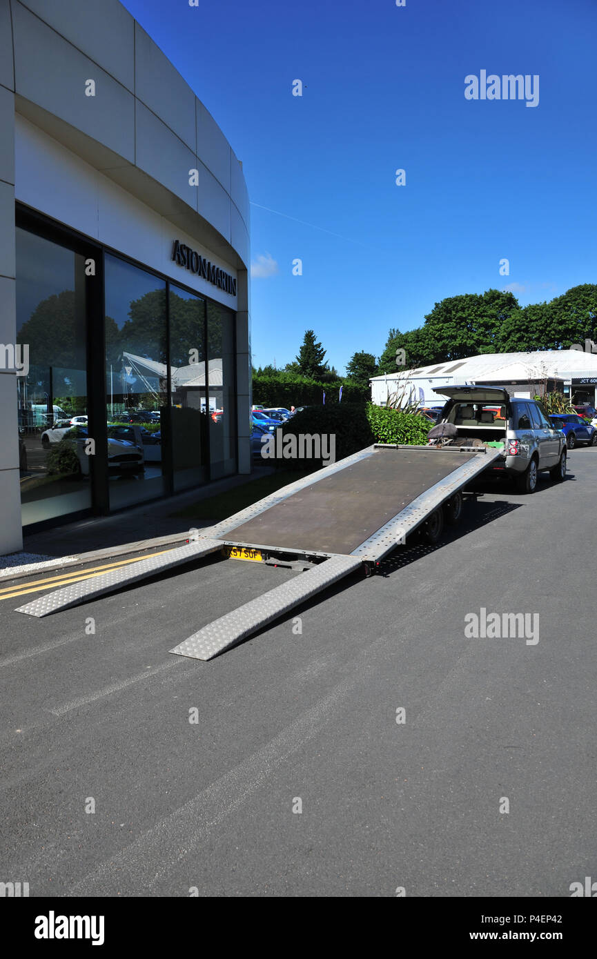 Large car trailer with ramps lowered ready for loading a car Stock