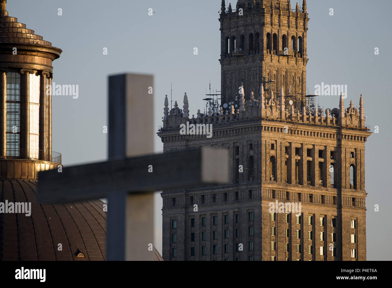 Dome of Holy Trinity Evangelical Church of the Augsburg Confession, 237 meter Palac Kultury i Nauki PKiN (Palace of Culture and Science) and cross mar Stock Photo