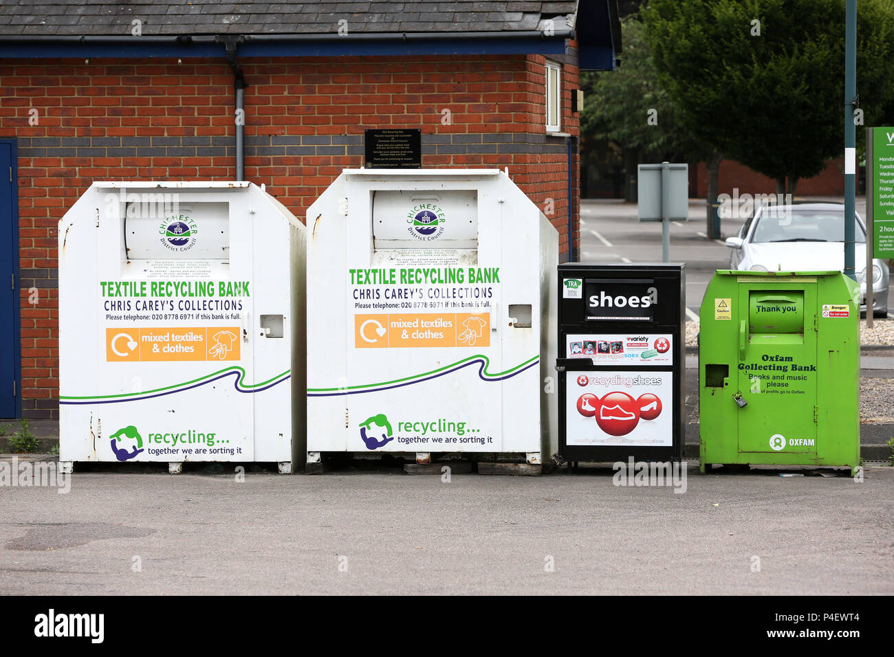 Clothes and textiles charity shop drop off bins pictured in Chichester, West Sussex, UK. Stock Photo