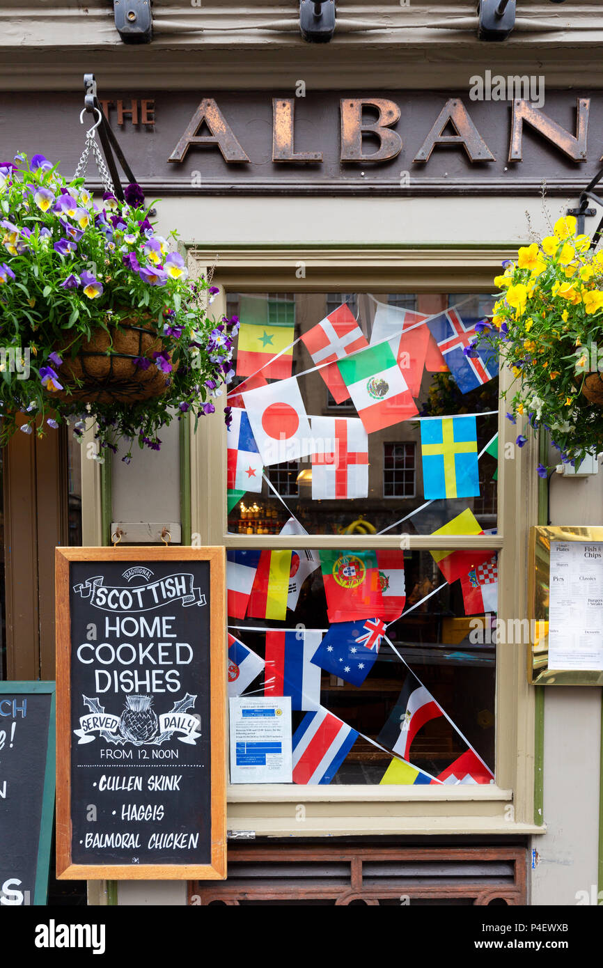 The Albanach pub - colourful exterior with flags of the European Union, The Albanach, High St., Edinburgh Scotland UK Stock Photo