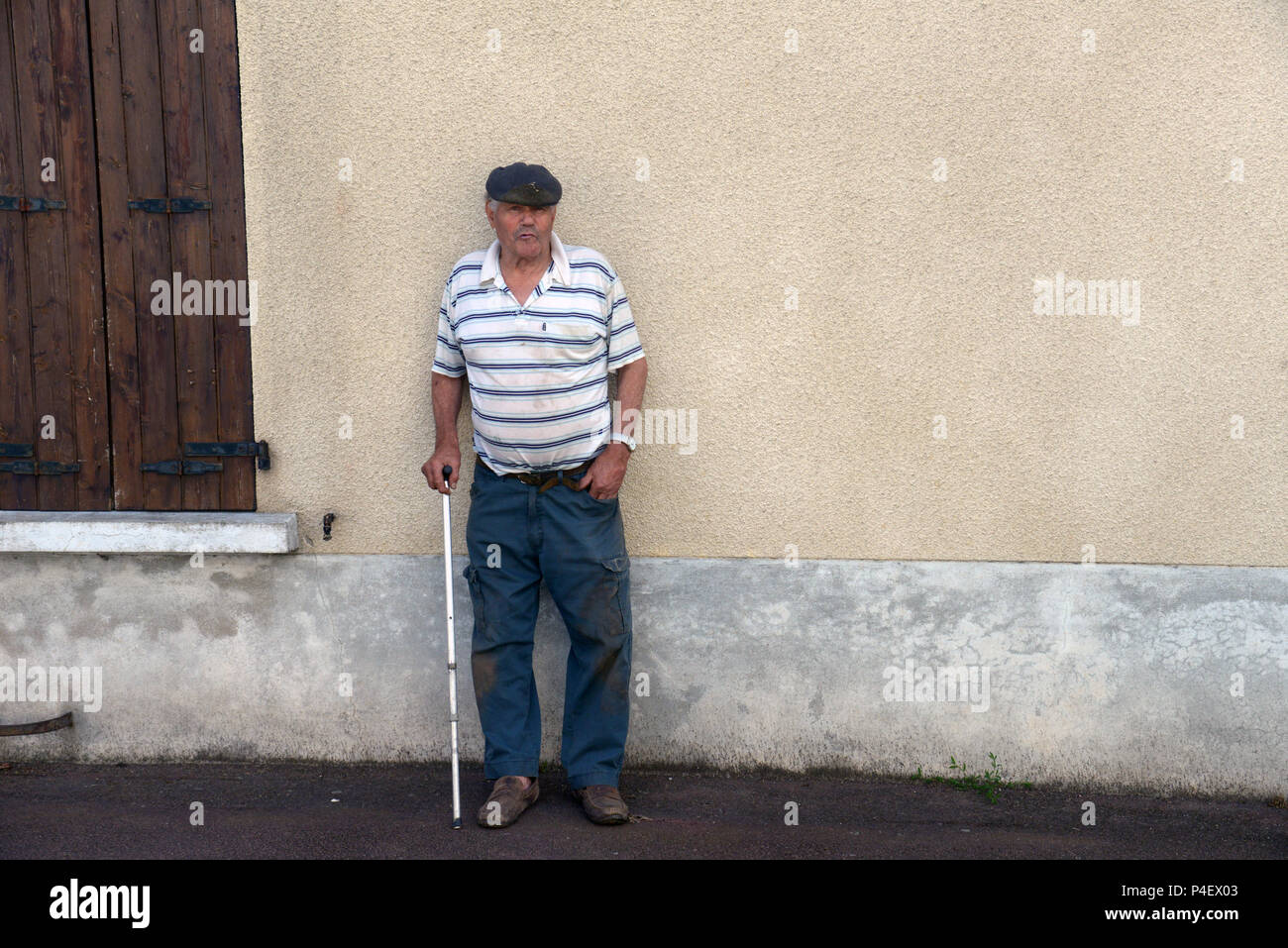 A local village retired man near his home in Roézé-sur-Sarthe, Pays-de-la-Loire in north-western France. Stock Photo