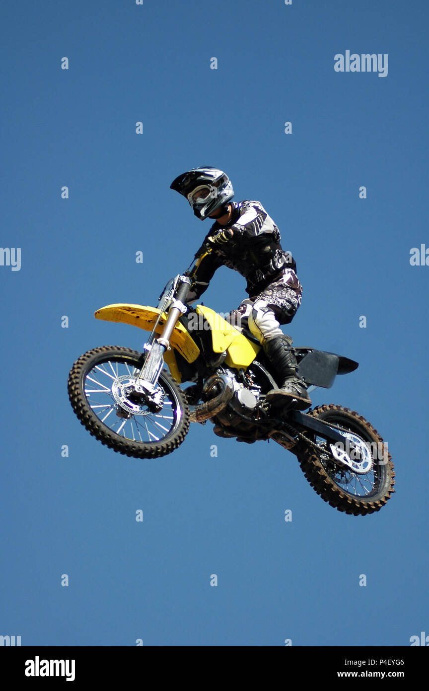 Moto X motorcycle jumping through the air Stock Photo - Alamy