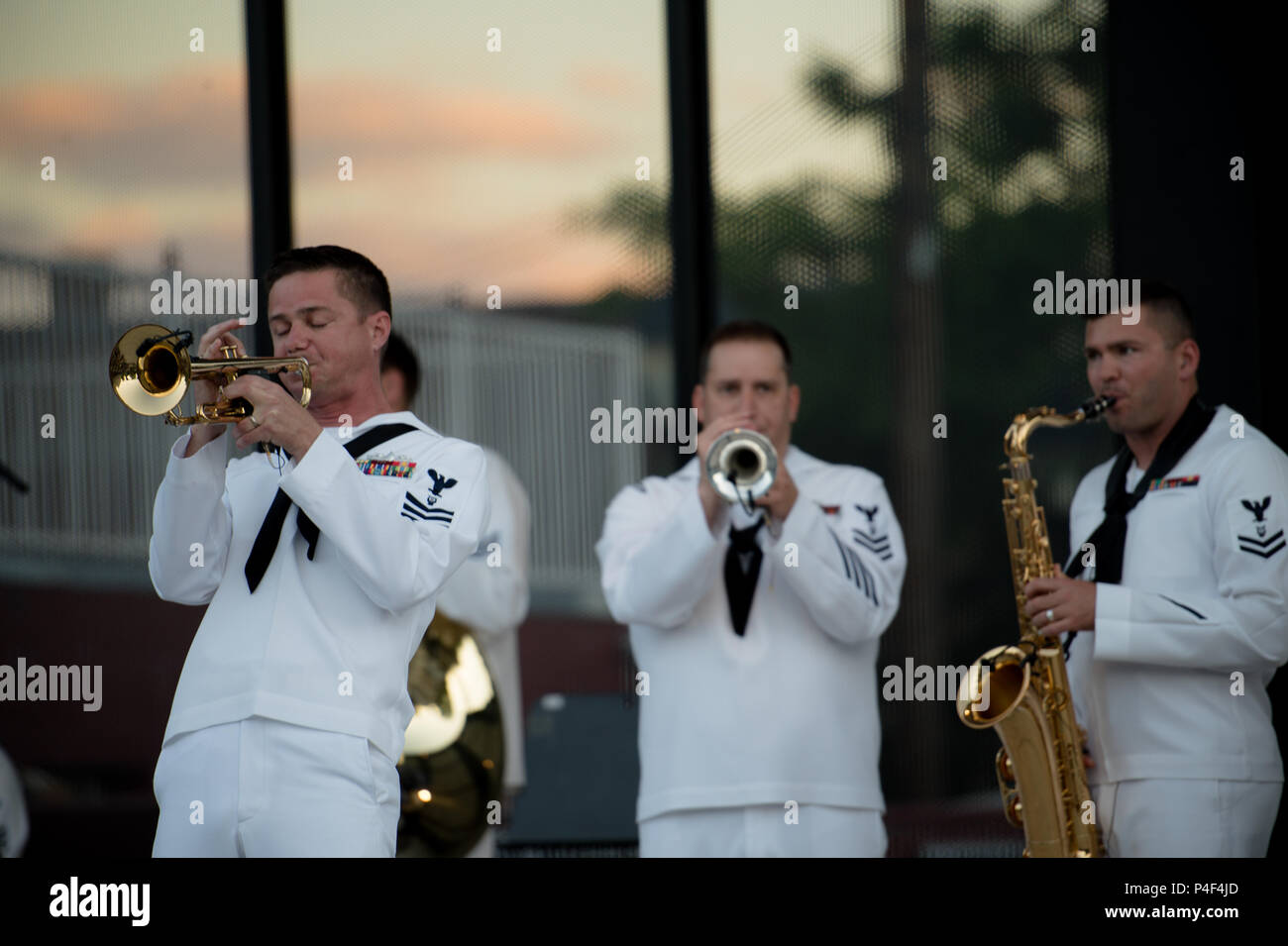 CARSON CITY, Nevada (June 19, 2018) Musician First Class Collin Reichow takes a solo during a Navy Week concert at McFadden Plaza. The Navy Office of Community Outreach uses the Navy Week program to bring Navy Sailors, equipment and displays to approximately 15 American cities each year for a week-long schedule of outreach engagements. (U.S. Navy Photo by Musician Second Class Nina Church/Released) Stock Photo