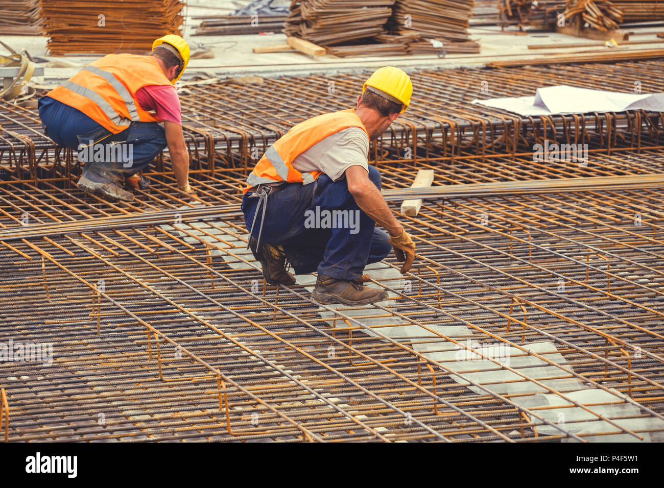 Ironworker workers working on concrete reinforcements at construction