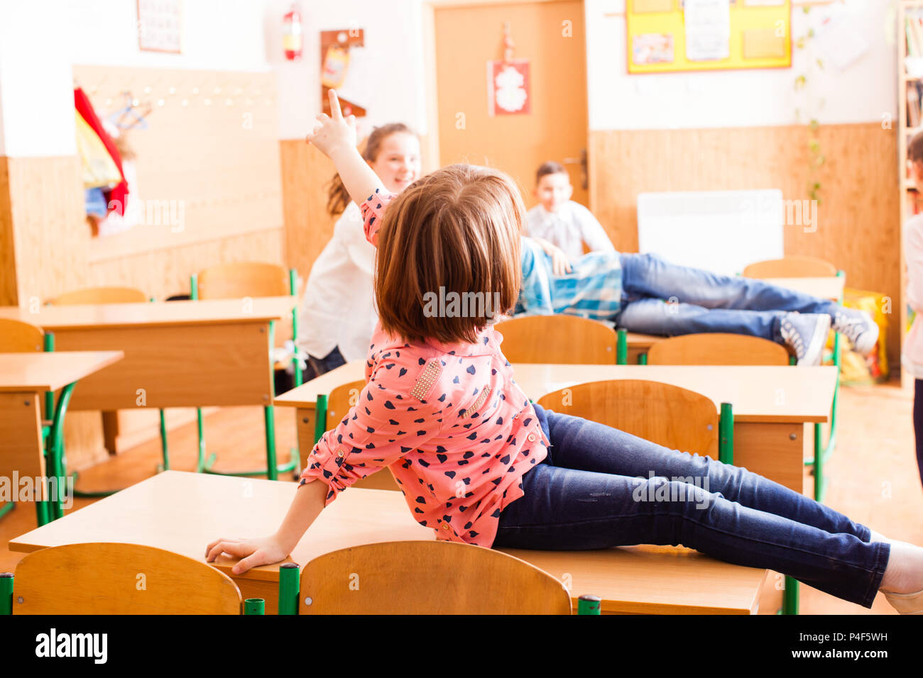 pupils are sitting on the desk after classes Stock Photo - Alamy