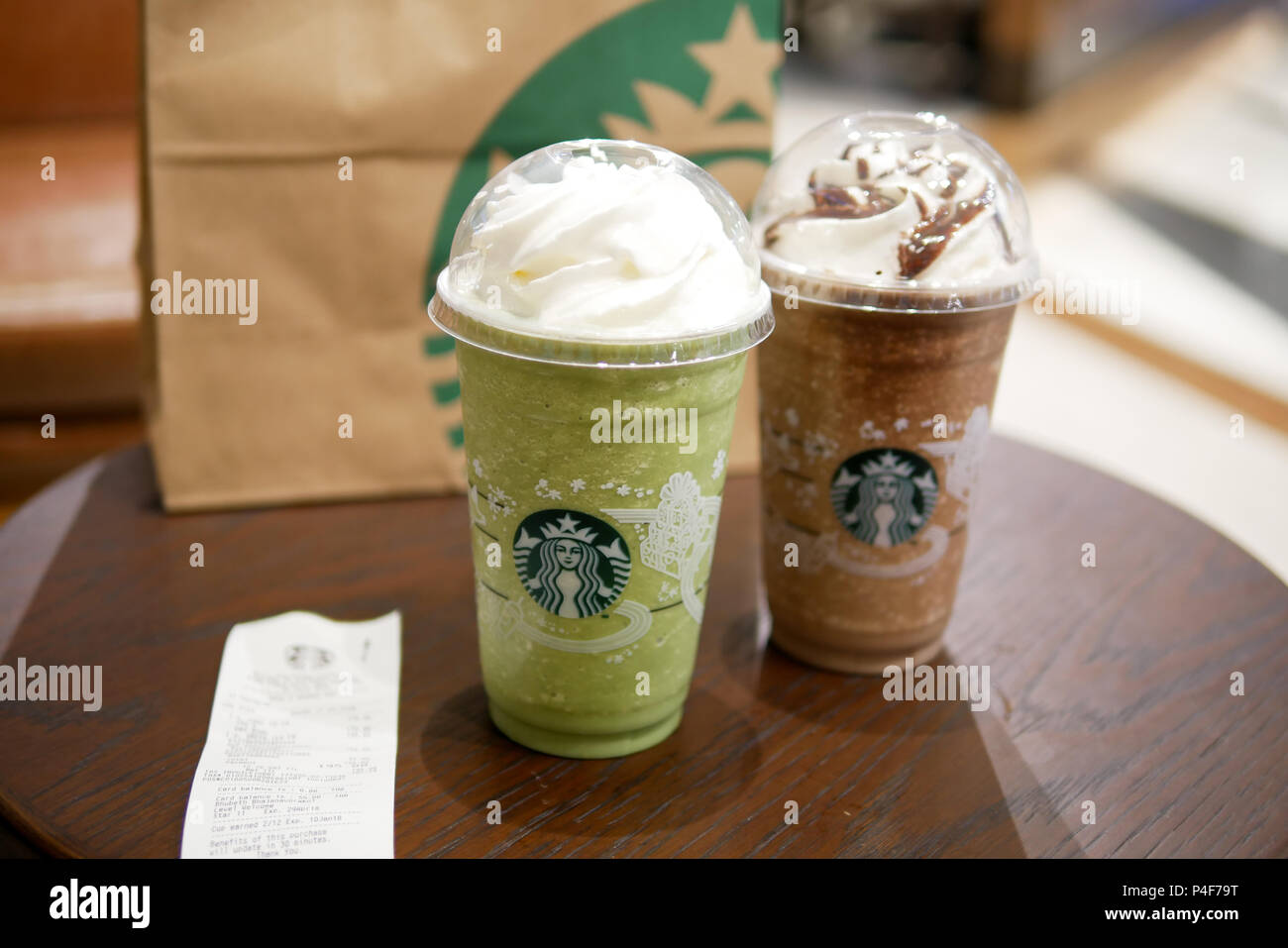 BANGKOK, THAILAND - DECEMBER 5, 2017: Chocolate and green tea frappe are the popular menu at Starbucks King Power Duty Free in Rangnam road. Stock Photo