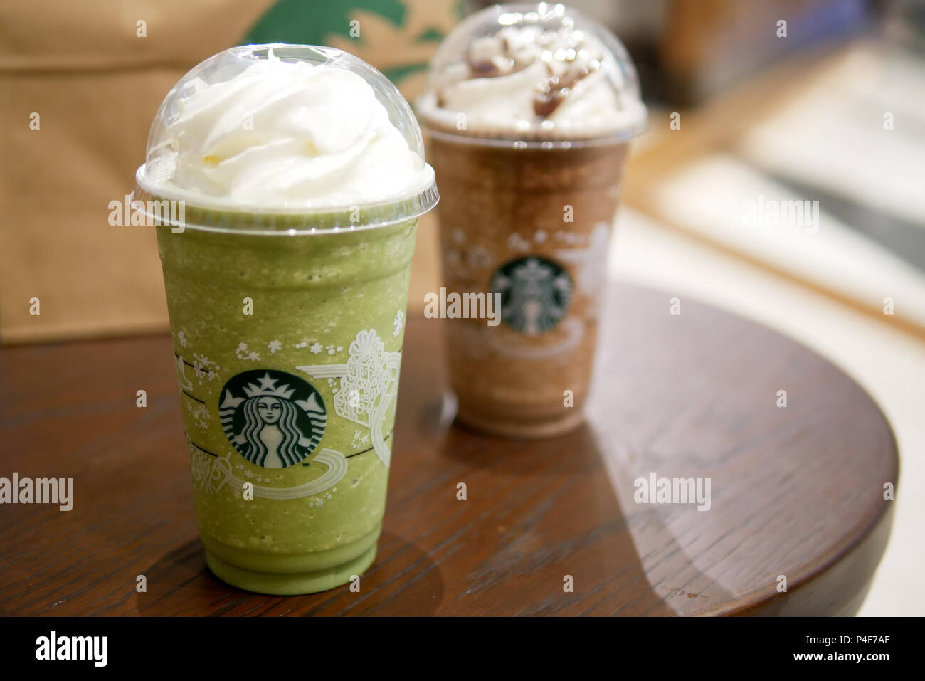 BANGKOK, THAILAND - DECEMBER 5, 2017: Chocolate and green tea frappe are the popular menu at Starbucks King Power Duty Free in Rangnam road. Stock Photo