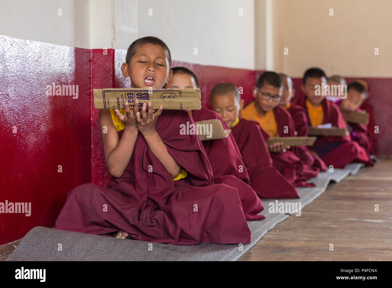 Gangtok, India - May 3, 2017: Lesson for novice monks in buddhist Tsuglakhang monastery in Gangtok, India Stock Photo