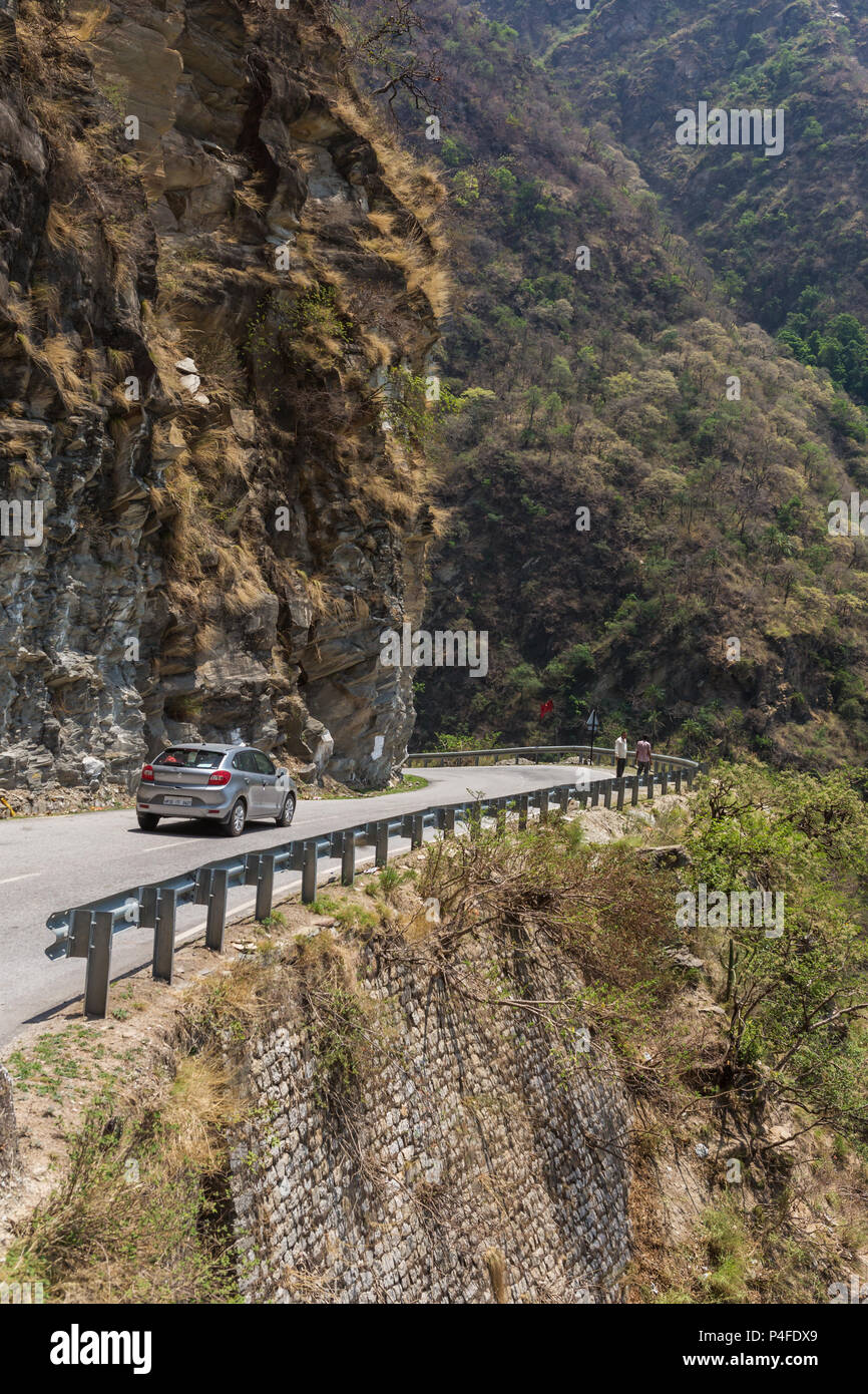 Manali, India - May 25, 2017: Car driving on dangerous mountain road in Himalayas on the way from Mandi to Manali Stock Photo