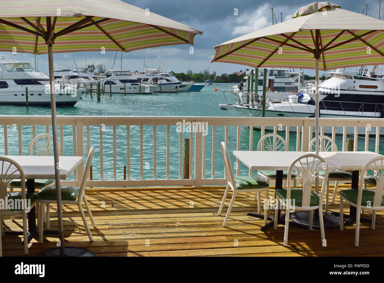 Seaside Restaurant outside next to yacht harbor in town of Marsh Harbour, Greater Abaco, Bahamas on bright sunny day. Stock Photo