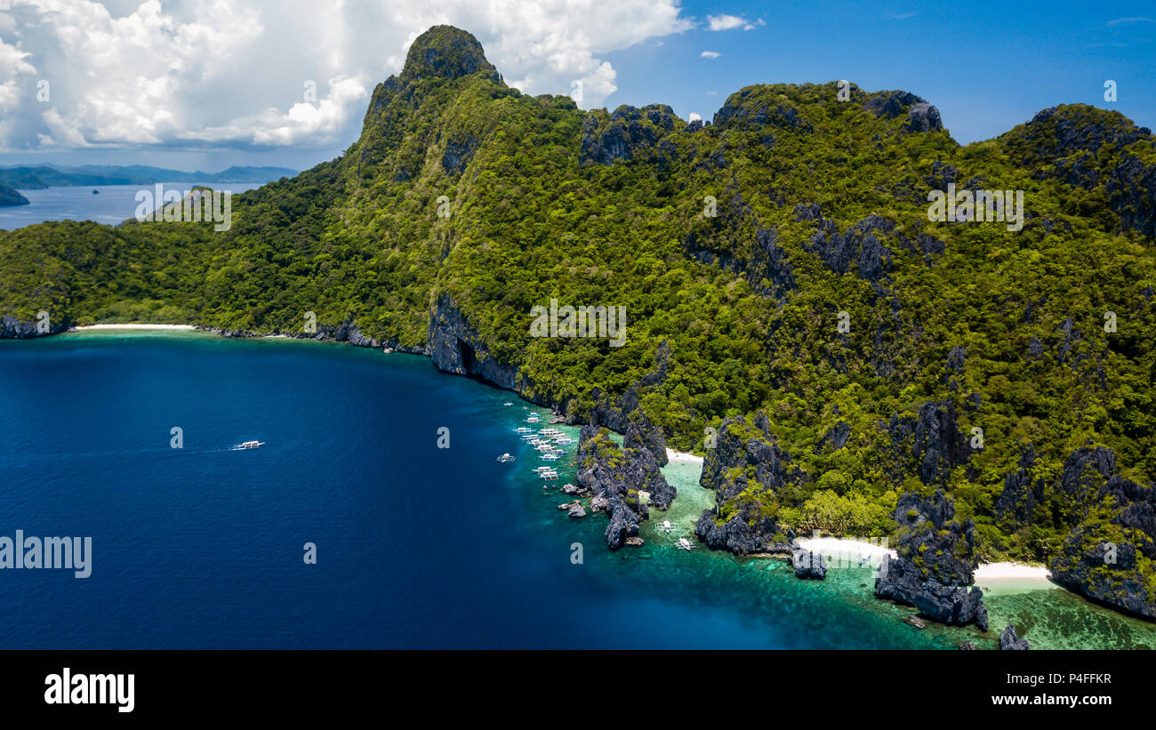 Aerial drone view of a beautiful rugged tropical archipelago with jagged cliffs and sandy beaches Stock Photo