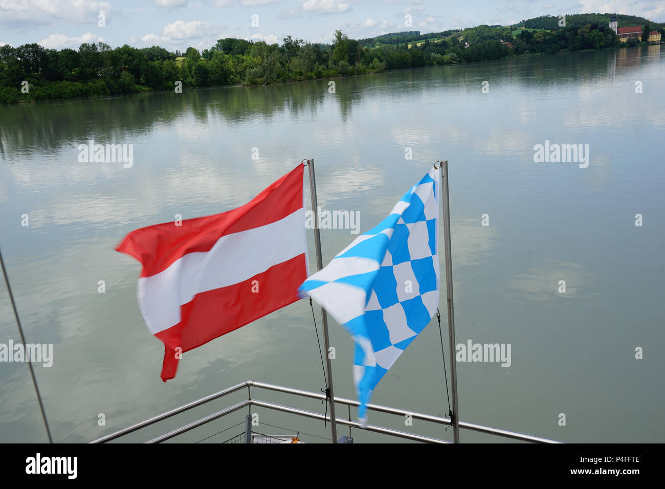 Flag of Austria and Bavaria,View to Vornbacher Enge, on the left  Vornbach Abbey, Vornbach, Boat Trip from Schärding Stock Photo