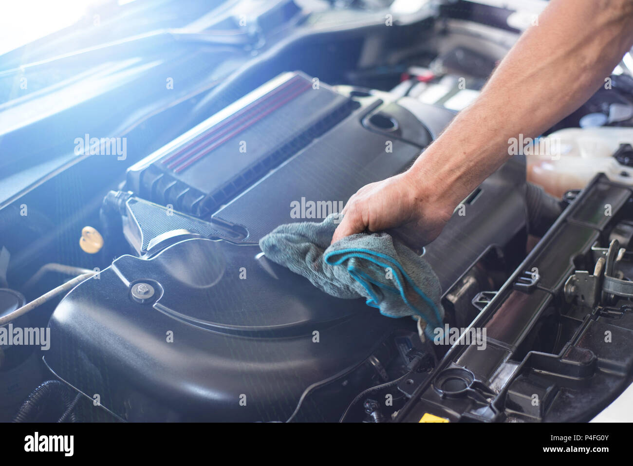 Mechanic cleaning car engine Stock Photo Alamy