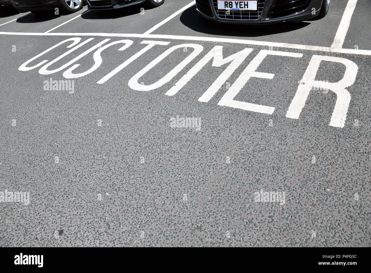 Sign written word Customer on Car Park customer reserved waiting areas at car dealership Stock Photo