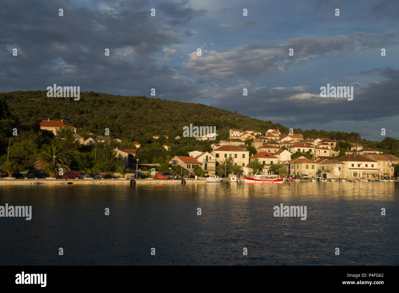 View of the small port at Drvenik Veli, Croatia, at sunset Stock Photo