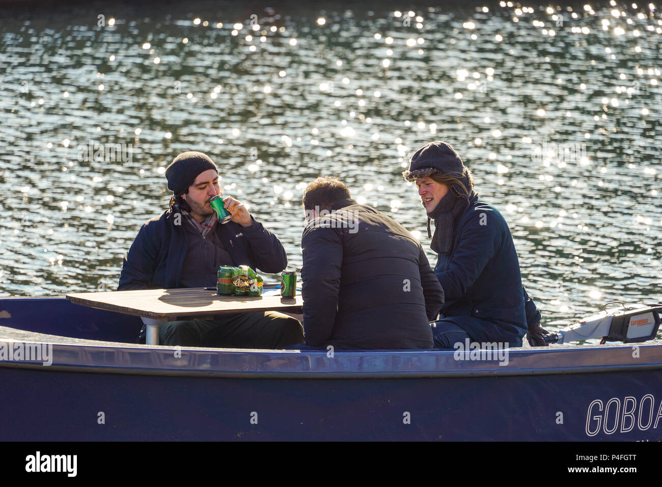 Three men on a boat in a Canal in Copenhagen, Denmark, relaxing, having  Tuborg Classic beer Stock Photo - Alamy