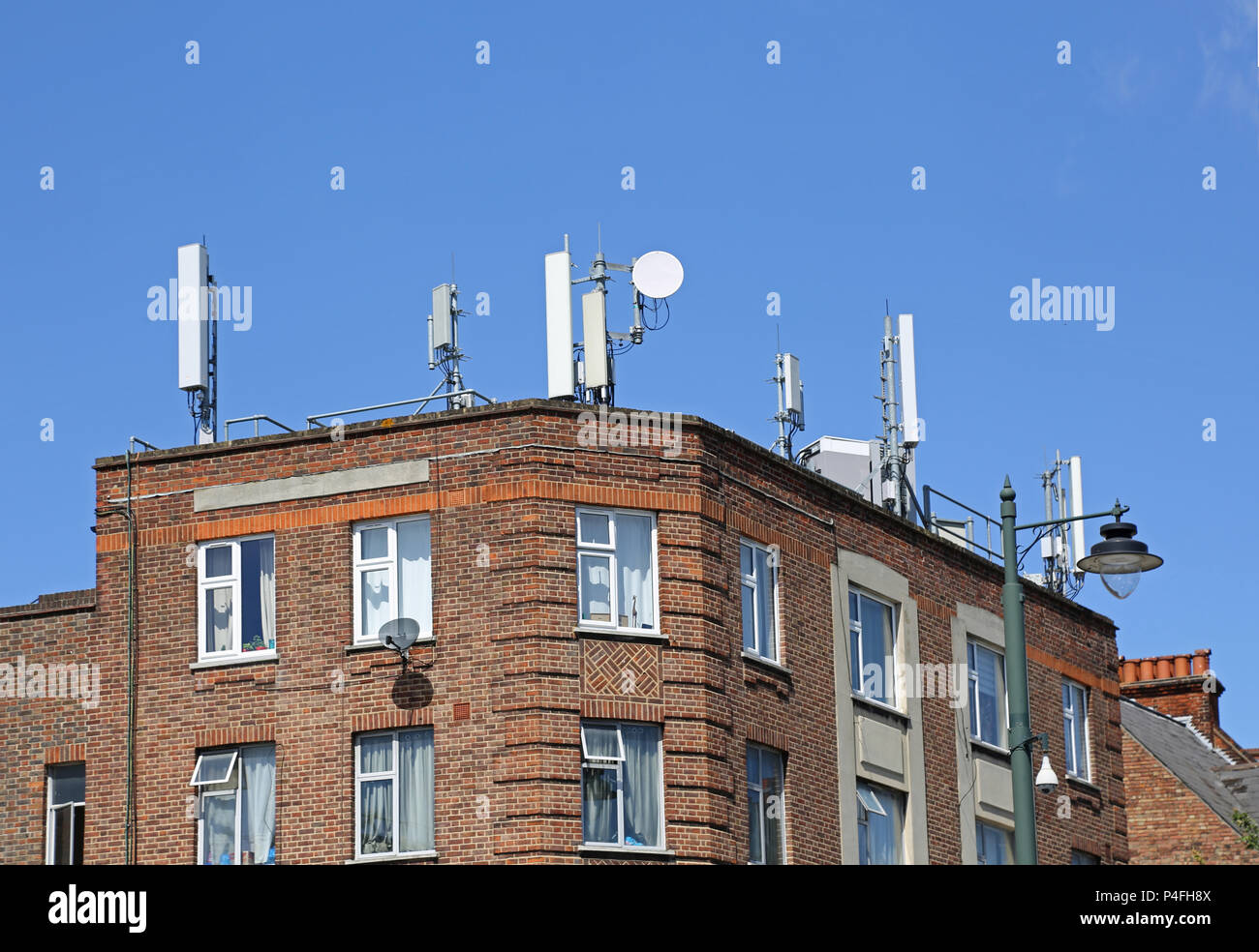 Mobile Phone antenna on the roof of a residential building in Tulse Hill, South London, UK Stock Photo