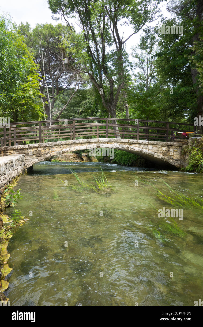 View of a small river passing under a bridge in Krka national park, Croatia Stock Photo