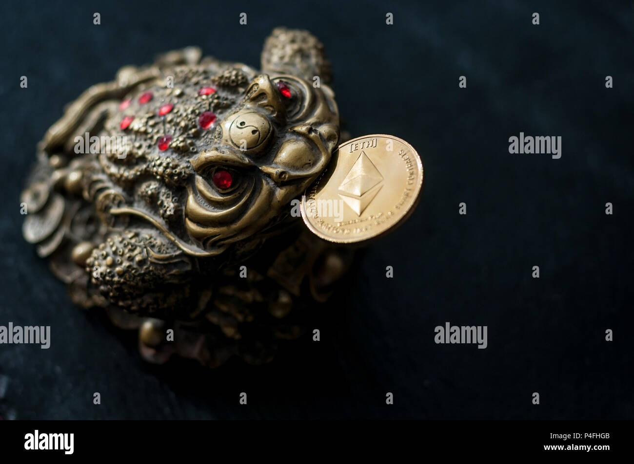 Chinese toad good luck with the Ethereum gold coin in your mouth Stock  Photo - Alamy