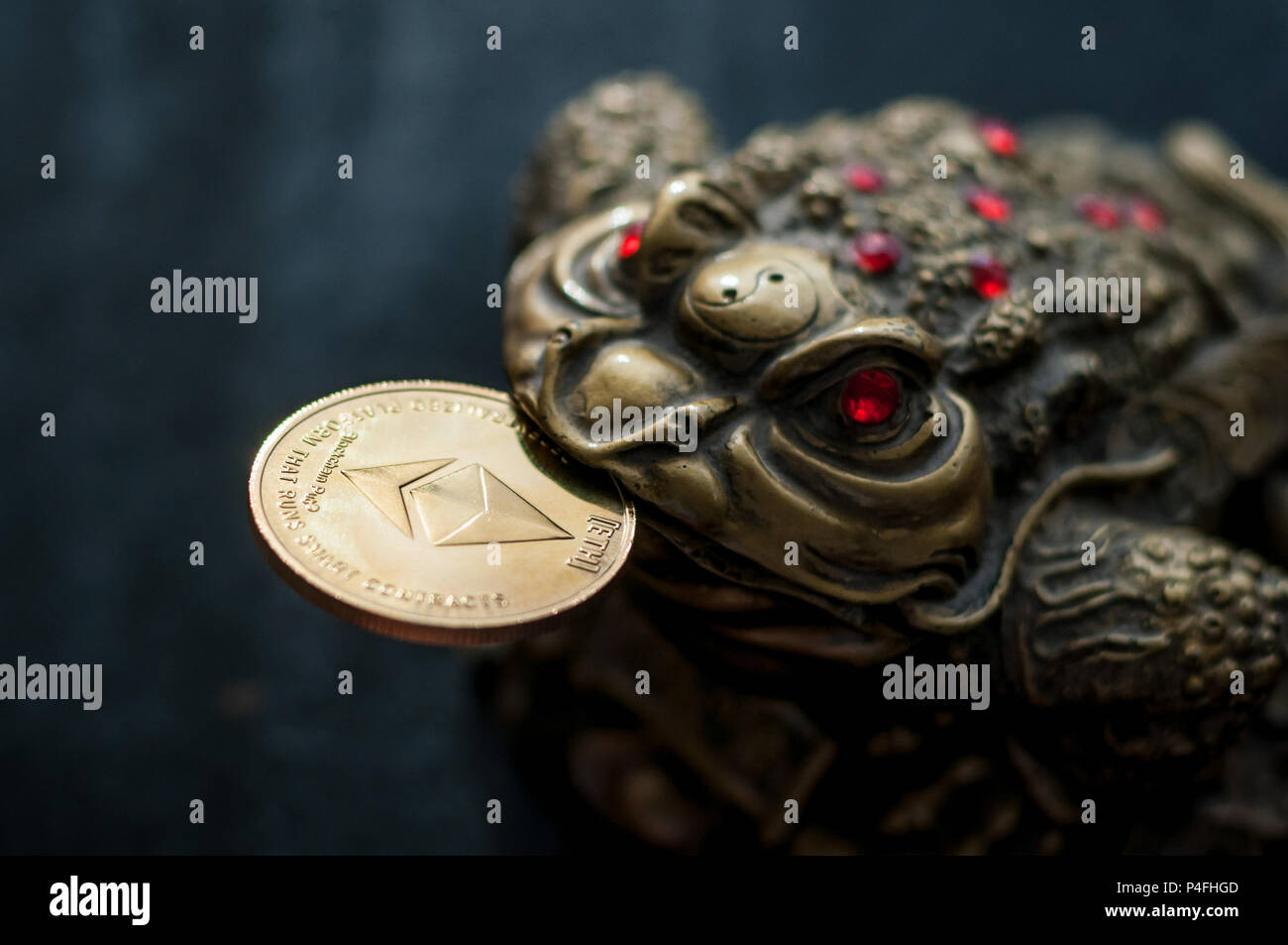 Chinese toad good luck with the Ethereum gold coin in your mouth Stock  Photo - Alamy