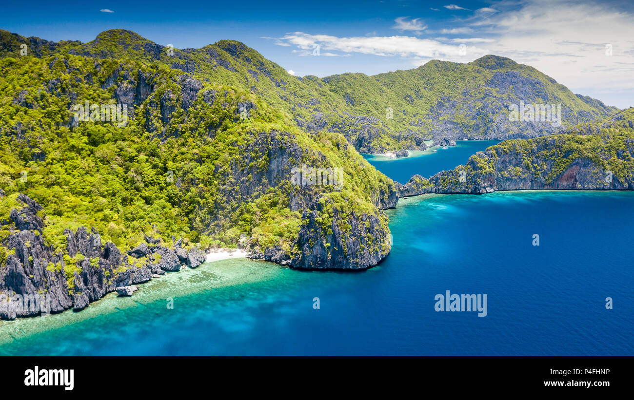 Aerial drone view of a beautiful tropical island with jagged cliffs and empty sandy beaches (El Nido, Palawan) Stock Photo