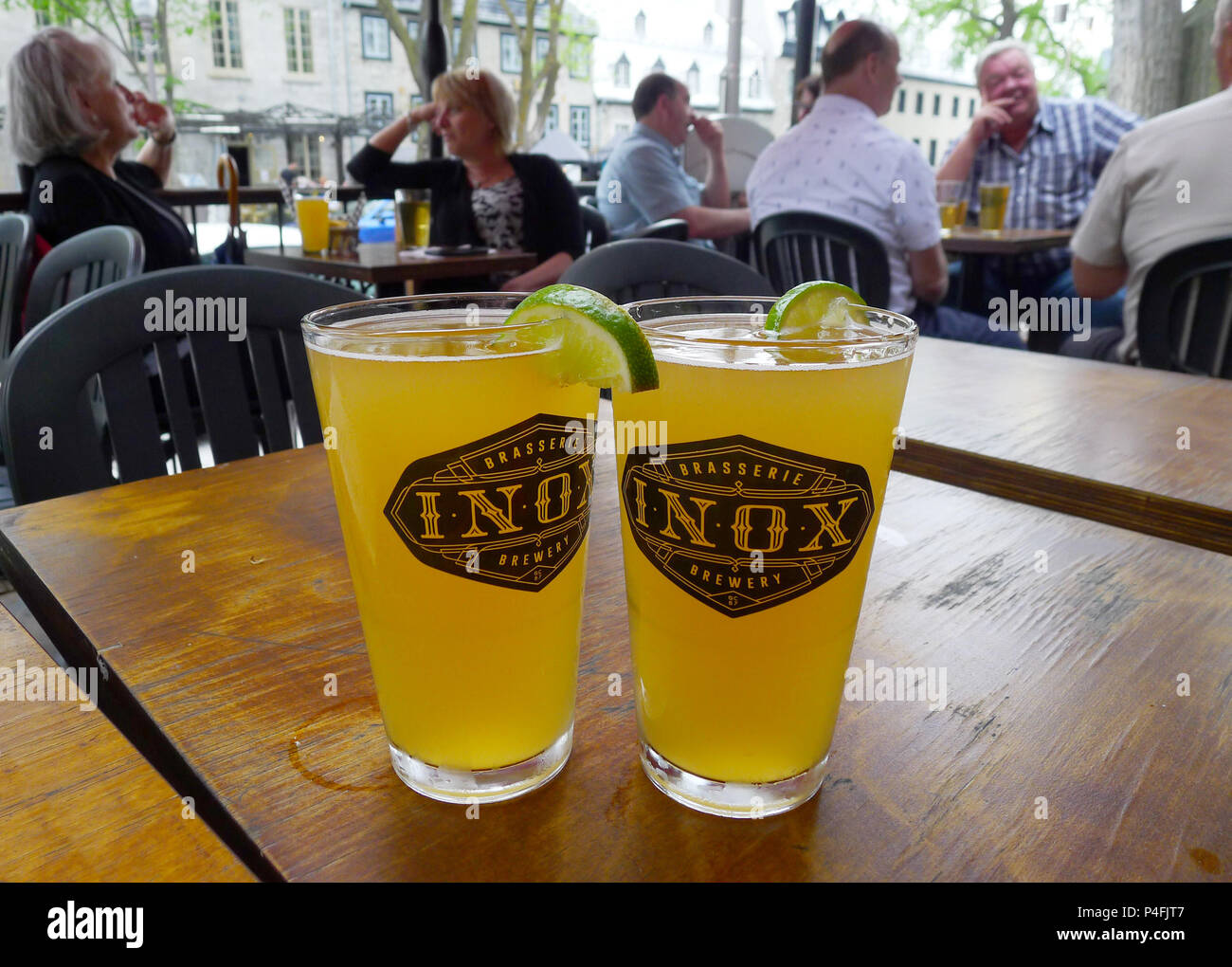 Two pints of wheat beer on a table at the Inox pub on Grande Allée in Quebec City Stock Photo