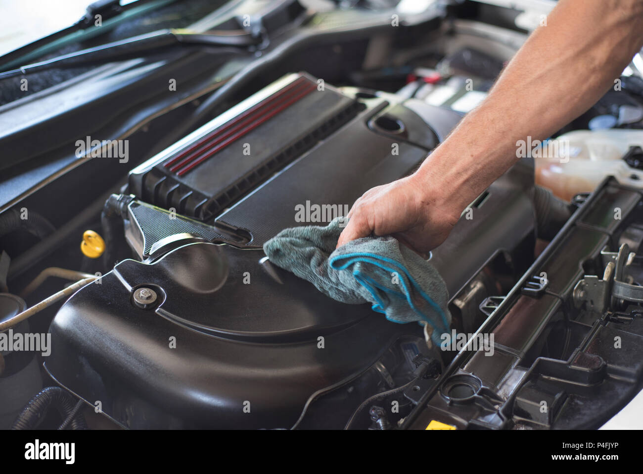 Mechanic cleaning car engine Stock Photo Alamy