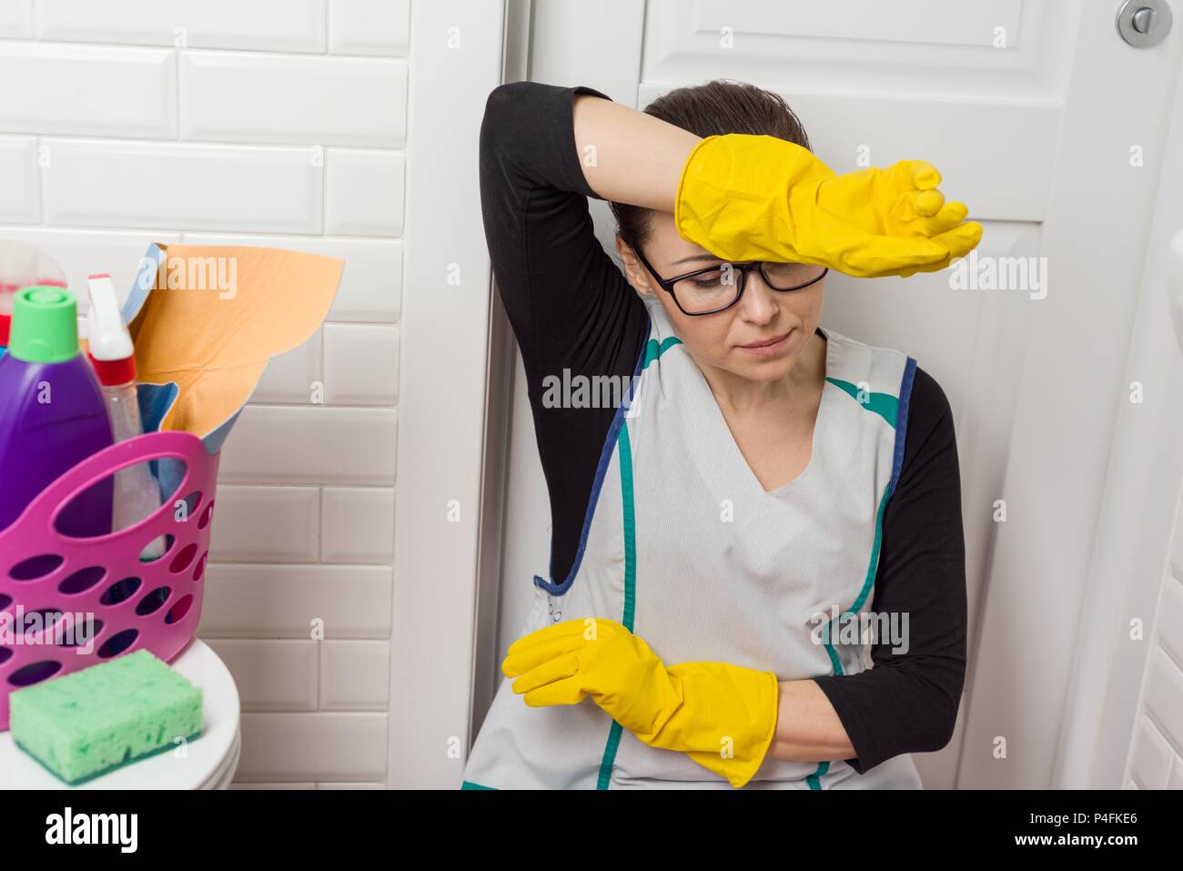 https://c8.alamy.com/comp/P4FKE6/tired-housewife-wipes-her-forehead-with-her-hand-P4FKE6.jpg