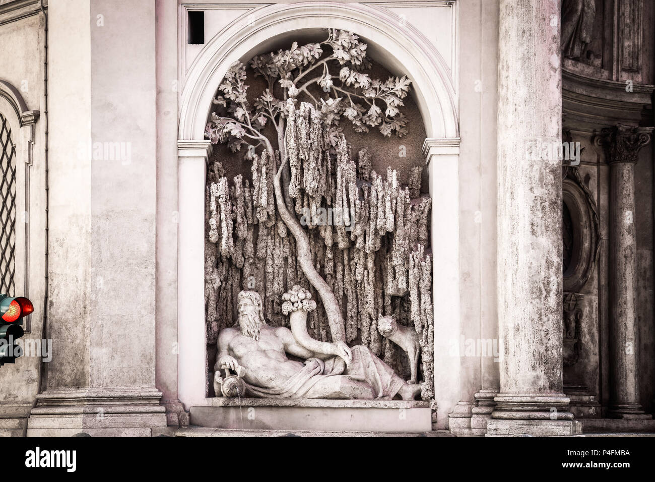 One of four fountains at crossroad in Rome, Quattro fontane square, Italy. Renaissance sculpture waits for green light Stock Photo