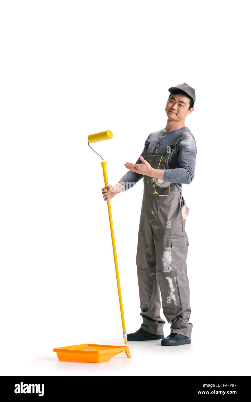 happy asian construction worker with roller brush on stick isolated on  white Stock Photo - Alamy