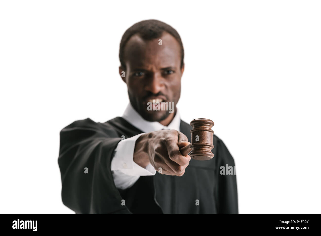 critical african american judge pointing with gavel isolated on white