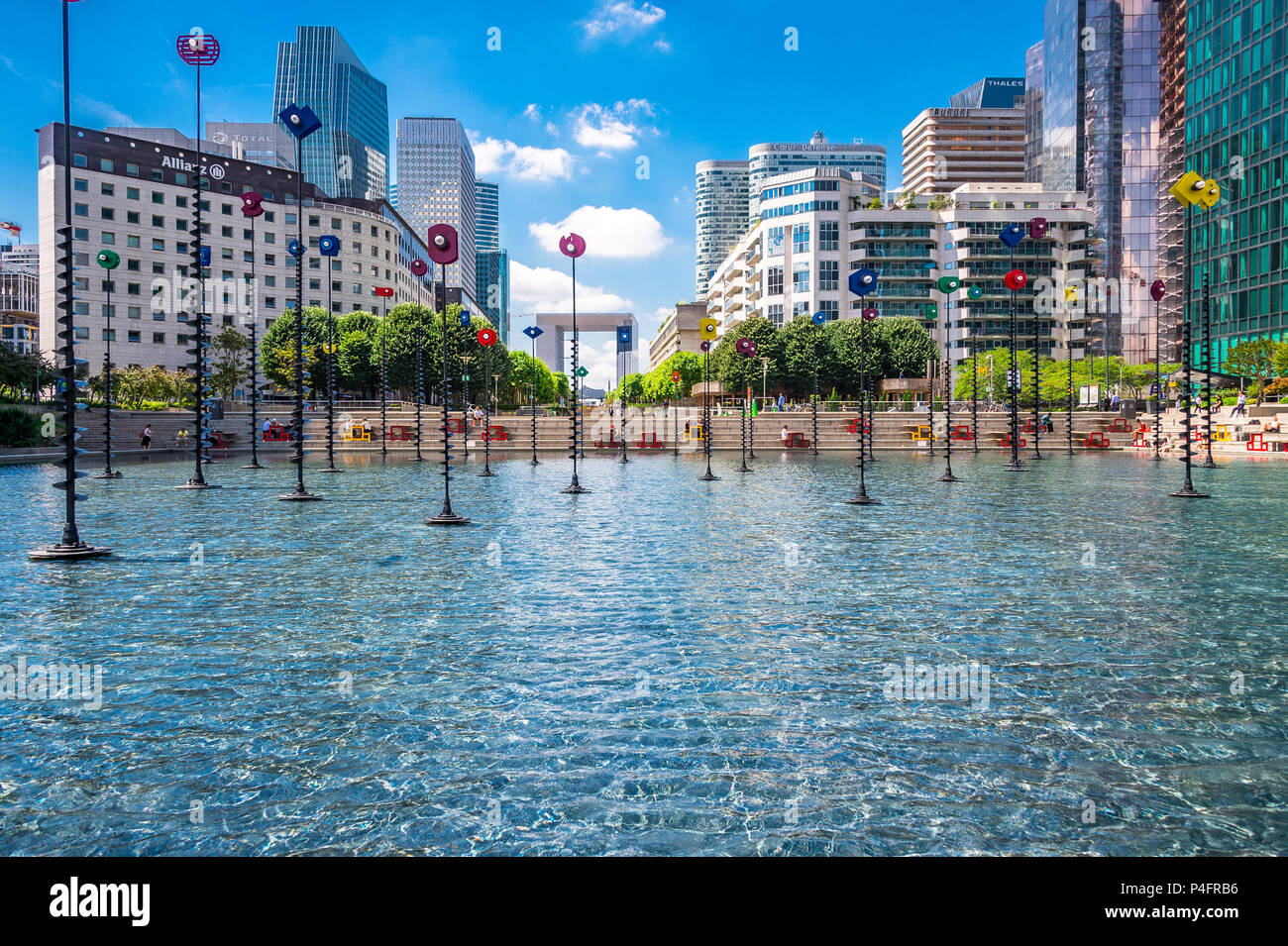 "Le Bassin de Takis" by Greek artist Takis is a colourful piece of art integrated into a water feature at La Defense in Paris, France Stock Photo