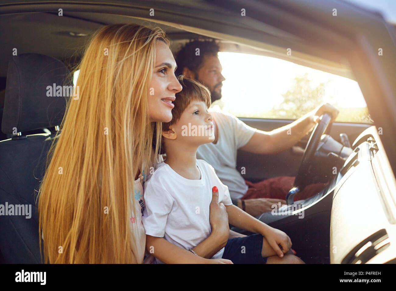 The family travels in the car in the summer Stock Photo