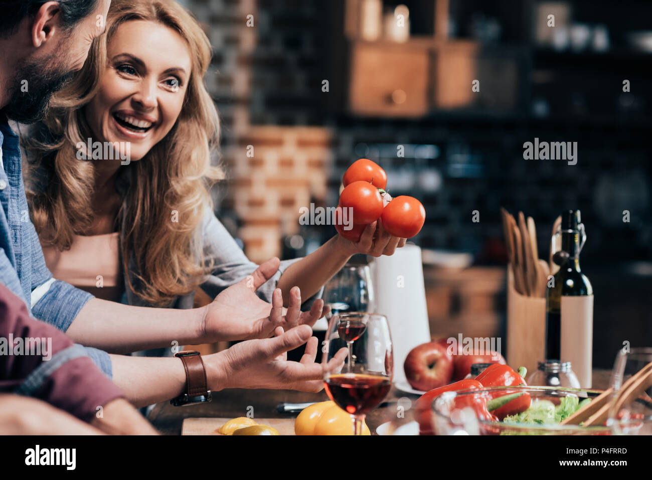 cropped shot of happy middle aged couple preparing dinner together Stock Photo