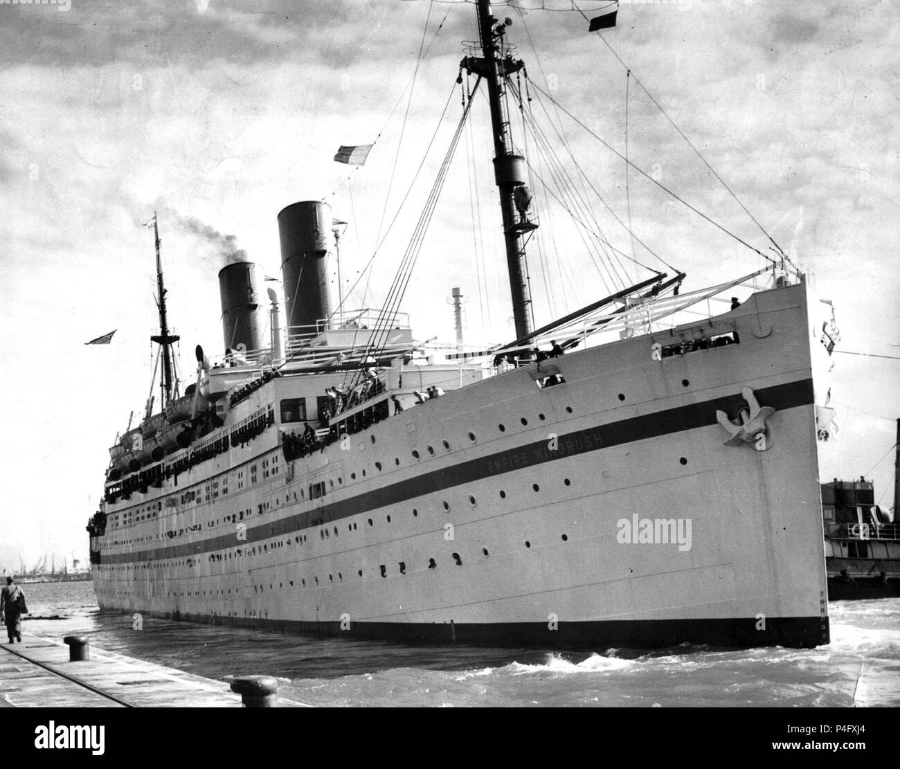 File photo dated 28/03/54 of the 14,651 ton British troopship, The 'Empire Windrush'. Theresa May, who has faced criticism, is expected to attend a Westminster Abbey service on Friday to mark the moment hundreds of Caribbean migrants departed the Empire Windrush ship in Tilbury Docks on June 22 1948. Stock Photo