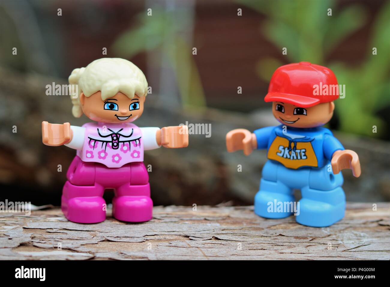 Duplo boy and girl characters against a blurred background - New Concept Stock Photo