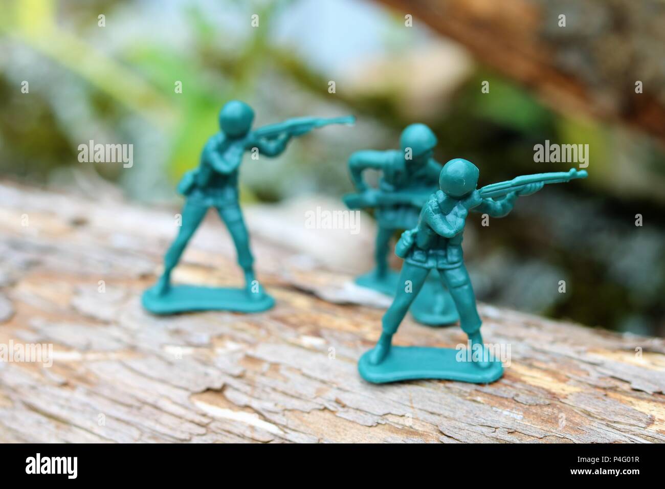 Plastic toy soldiers showing a battle scene - News Concept Stock Photo