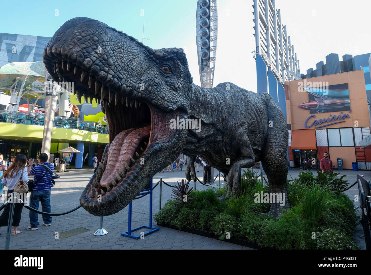 Los Angeles, USA. 21st June, 2018. A giant Tyrannosaurus rex statue is seen at Universal CityWalk in Los Angeles, the United States, on June 21, 2018. For the promotion of the screening of the new film 'Jurassic World: Fallen Kingdom' on Universal Cinema Theatres, a colossal 3-ton Tyrannosaurus rex, a life-sized Gyrosphere original movie prop, as well as original costume, are displayed for public at Universal CityWalk. Credit: Zhao Hanrong/Xinhua/Alamy Live News Stock Photo