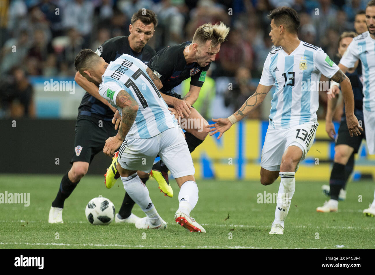 Nizhny Novgorod, Russia. 21 June 2018.  Ivan RAKITIC (mi., CRO) is overturned by Nicolas OTAMENDI (ARG), Action, duels, Argentina (ARG) - Croatia (CRO) 0: 3, Preliminary Round, Group D, Match 23, on 21.06.2018 in Moscow; Football World Cup 2018 in Russia from 14.06. - 15.07.2018. | usage worldwide Credit: dpa/Alamy Live News Credit: dpa picture alliance/Alamy Live News Stock Photo